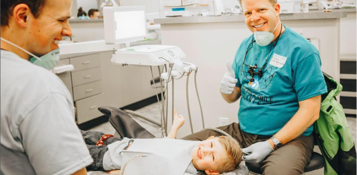 Hero Image of Doctor and kid at the dentist office